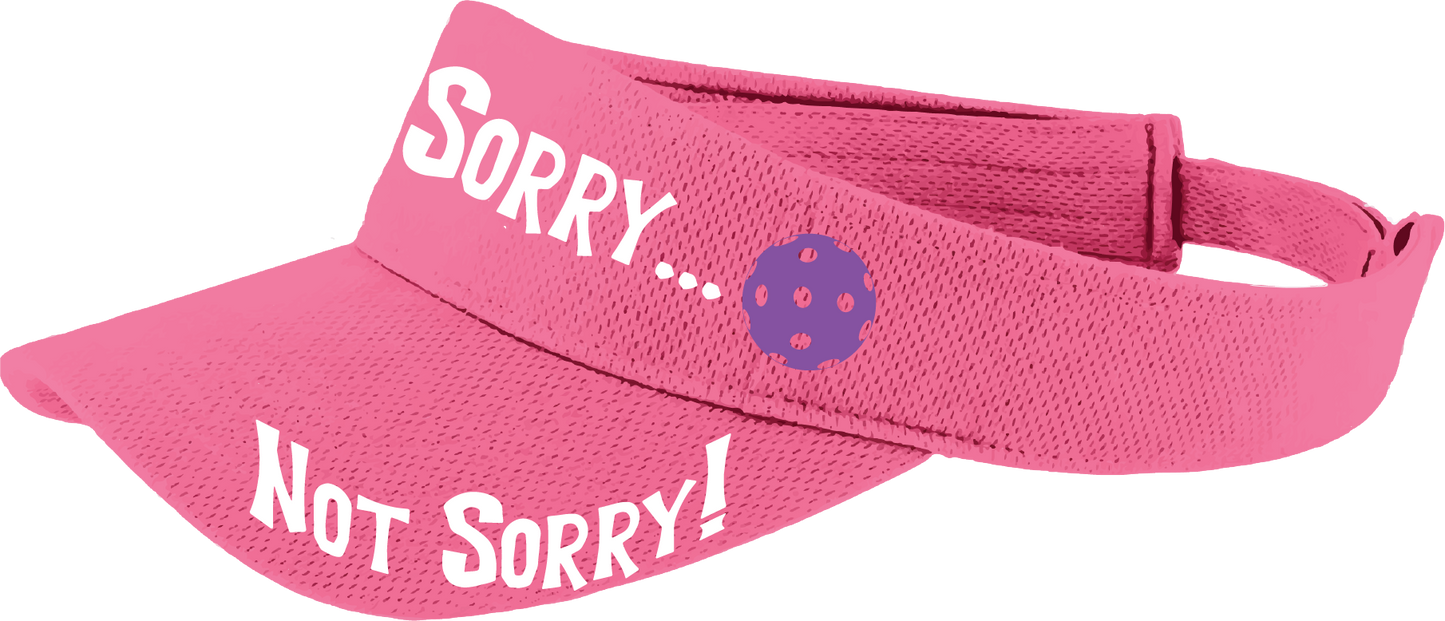 Pcikleball Visor Design: Sorry...Not Sorry!!!  Customizable Ball Color in eight colors  This fun pickleball visor is the perfect accessory for all pickleball players needing to keep their focus on the game and not the sun. The moisture-wicking material is made of 100% polyester with closed-hole flat back mesh and PosiCharge Technology. The back closure is a hook and loop style made to adjust to every adult.