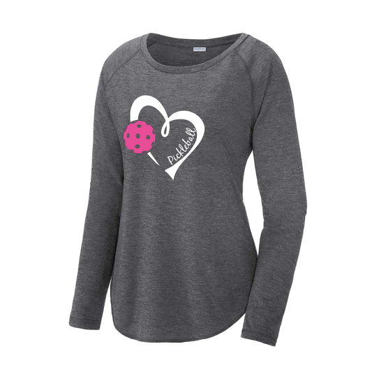 Pickleball Design: Heart with Pickleball  Women's Style: Long Sleeve Scoop-Neck  Turn up the volume in this Women's shirt with its perfect mix of softness and attitude. Material is ultra-comfortable with moisture wicking properties and tri-blend softness. PosiCharge technology locks in color. Highly breathable and lightweight.