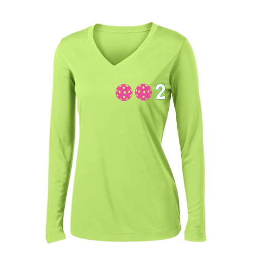 Design: 002 with Customizable Ball Colors (Yellow, Pink, White)  Women's Style:  Long-Sleeve V-Neck  Shirts are lightweight, roomy and highly breathable. These moisture-wicking shirts are designed for athletic performance. They feature PosiCharge technology to lock in color and prevent logos from fading. Removable tag and set-in sleeves for comfo