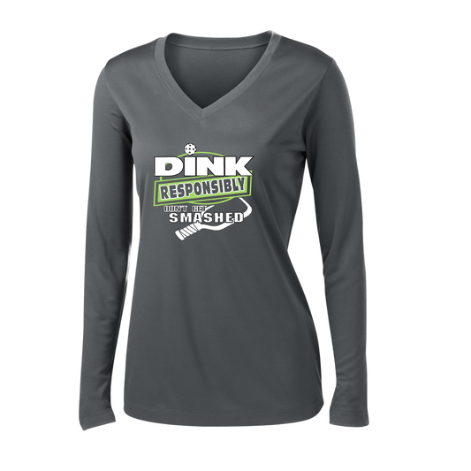 Pickleball Design: Dink Responsibly - Don't Get Smashed  Women's Style: Long Sleeve V-Neck  Turn up the volume in this Women's shirt with its perfect mix of softness and attitude. Material is ultra-comfortable with moisture wicking properties and tri-blend softness. PosiCharge technology locks in color. Highly breathable and lightweight.
