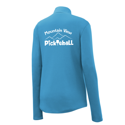 Pickleball Design: Mountain View Pickleball Club  Women's 1/4-Zip Pullover:  Princess seams and Drop tail hem.  Turn up the volume in this Women's shirt with its perfect mix of softness and attitude. Material is ultra-comfortable with moisture wicking properties and tri-blend softness. PosiCharge technology locks in color. Highly breathable and lightweight. Versatile enough for wearing year-round.