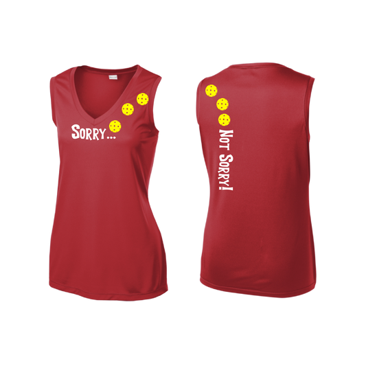 Pickleball Design: Sorry...Not Sorry with Customizable Ball Color – White, Green, Yellow or Pink Balls.   Women's Styles: Sleeveless Tank Turn up the volume in this Women's shirt with its perfect mix of softness and attitude. Material is ultra-comfortable with moisture wicking properties and tri-blend softness. PosiCharge technology locks in color. Highly breathable and lightweight.