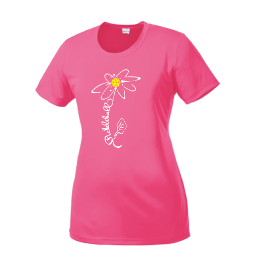 Pickleball Design: Pickleball Flower  Women's Style: Short Sleeve Crew-Neck  Turn up the volume in this Women's shirt with its perfect mix of softness and attitude. Material is ultra-comfortable with moisture wicking properties and tri-blend softness. PosiCharge technology locks in color. Highly breathable and lightweight.