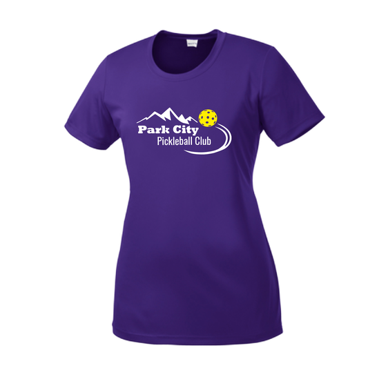 Pickleball Design: Park City Pickleball Club (white words)  Women's Style:  Short-Sleeve Crew-Neck  Shirts are lightweight, roomy and highly breathable. These moisture-wicking shirts are designed for athletic performance. They feature PosiCharge technology to lock in color and prevent logos from fading. Removable tag and set-in sleeves for comfort.