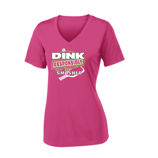 Pickleball Design: Dink Responsibly - Don't Get Smashed  Women's Style:  Short Sleeve V-Neck  Turn up the volume in this Women's shirt with its perfect mix of softness and attitude. Material is ultra-comfortable with moisture wicking properties and tri-blend softness. PosiCharge technology locks in color. Highly breathable and lightweight.