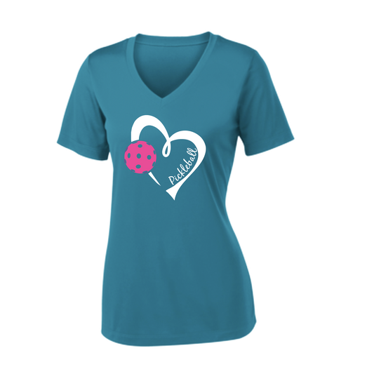 Pickleball Design: Heart with Pickleball  Women's Style: Short Sleeve V-Neck  Turn up the volume in this Women's shirt with its perfect mix of softness and attitude. Material is ultra-comfortable with moisture wicking properties and tri-blend softness. PosiCharge technology locks in color. Highly breathable and lightweight.