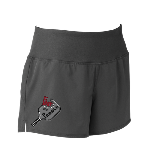 Shorts Pickleball Design: Fear the Paddle  Sport Tek women’s repeat shorts come with built-in cell phone pocket on the exterior of the waistband. You can also feel secure knowing that no matter how strenuous the exercise, the shorts will remain in place (it won’t ride up!). These shorts are extremely versatile and trendy. Transition from the Pickleball court to running errands smoothly.