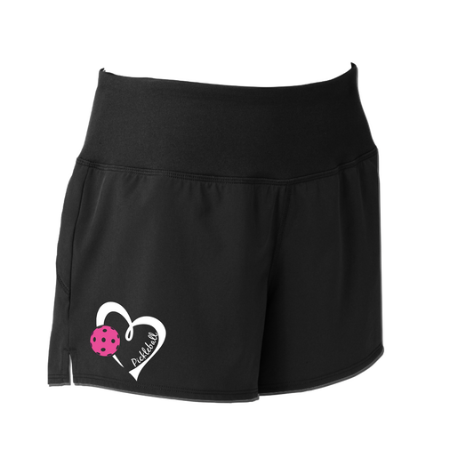 Pickleball Shorts Design: Pickleball Heart  Sport Tek women’s repeat shorts come with built-in cell phone pocket on the exterior of the waistband. You can also feel secure knowing that no matter how strenuous the exercise, the shorts will remain in place (it won’t ride up!). These shorts are extremely versatile and trendy. Transition from the Pickleball court to running errands smoothly.