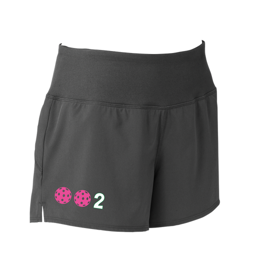 Designs: 002 with customizable Pickleballs (Yellow, White, Pink, Green).  Sport Tek women’s repeat shorts come with built-in cell phone pocket on the exterior of the waistband. You can also feel secure knowing that no matter how strenuous the exercise, the shorts will remain in place (it won’t ride up!). These shorts are extremely versatile and trendy. Transition from the Pickleball court to running errands smoothly