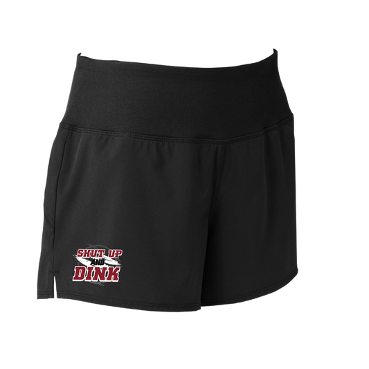 Pickleball Short Design: Shut Up and Dink  Sport Tek women’s repeat shorts come with built-in cell phone pocket on the exterior of the waistband. You can also feel secure knowing that no matter how strenuous the exercise, the shorts will remain in place (it won’t ride up!). These shorts are extremely versatile and trendy. Transition from the Pickleball court to running errands smoothly.