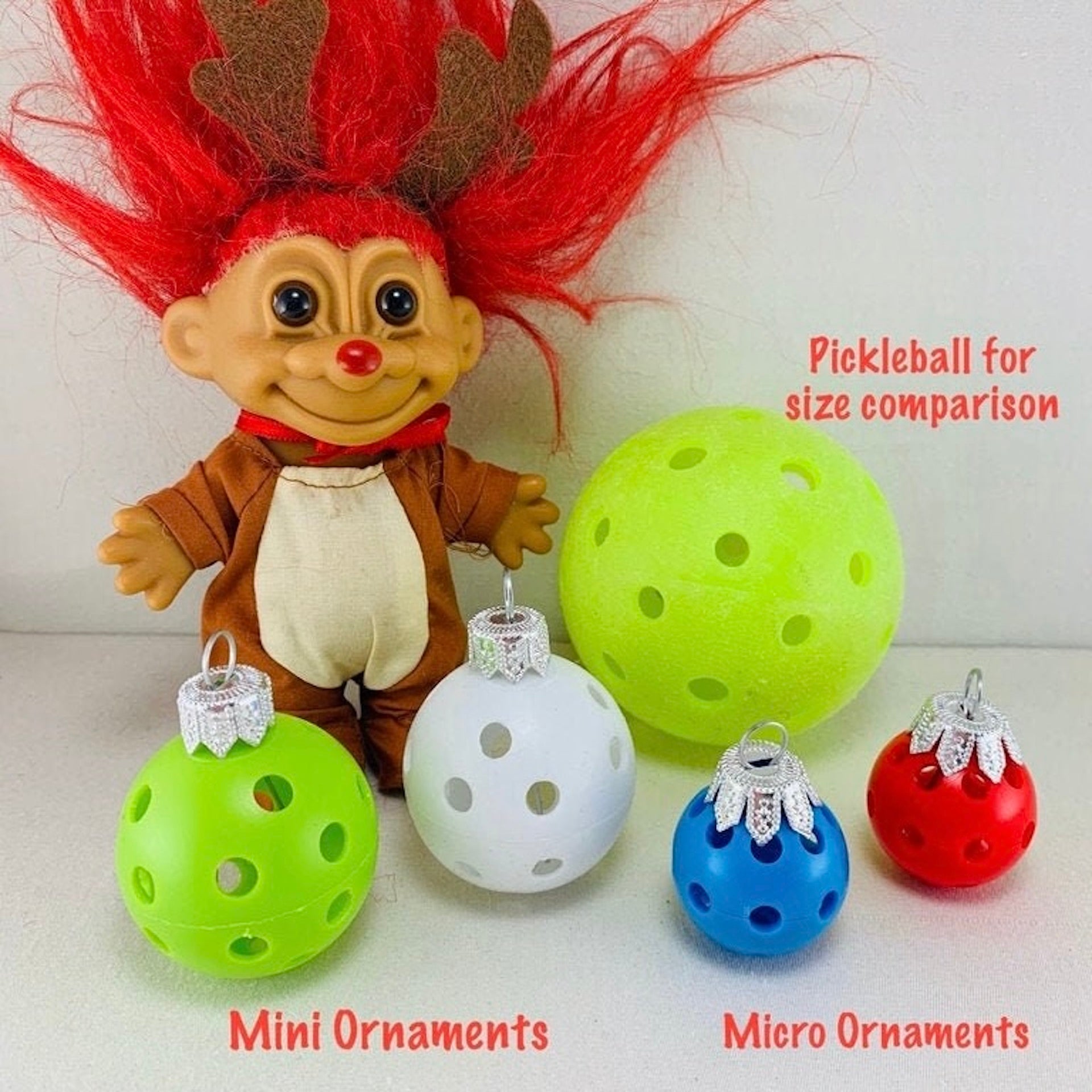 Mini Pickleball Christmas Ornaments - Set of 12  Each order gets you one set of twelve ornaments. From this moment forward – CELEBRATE EVERYTHING PICKLEBALL STYLE. Purchase these cute pickleball ornaments and decorate your own tree. If you are having trouble finding the perfect gift for your pickleball friends this is it. Small enough for the RV’ers and fun and festive enough to display all year.